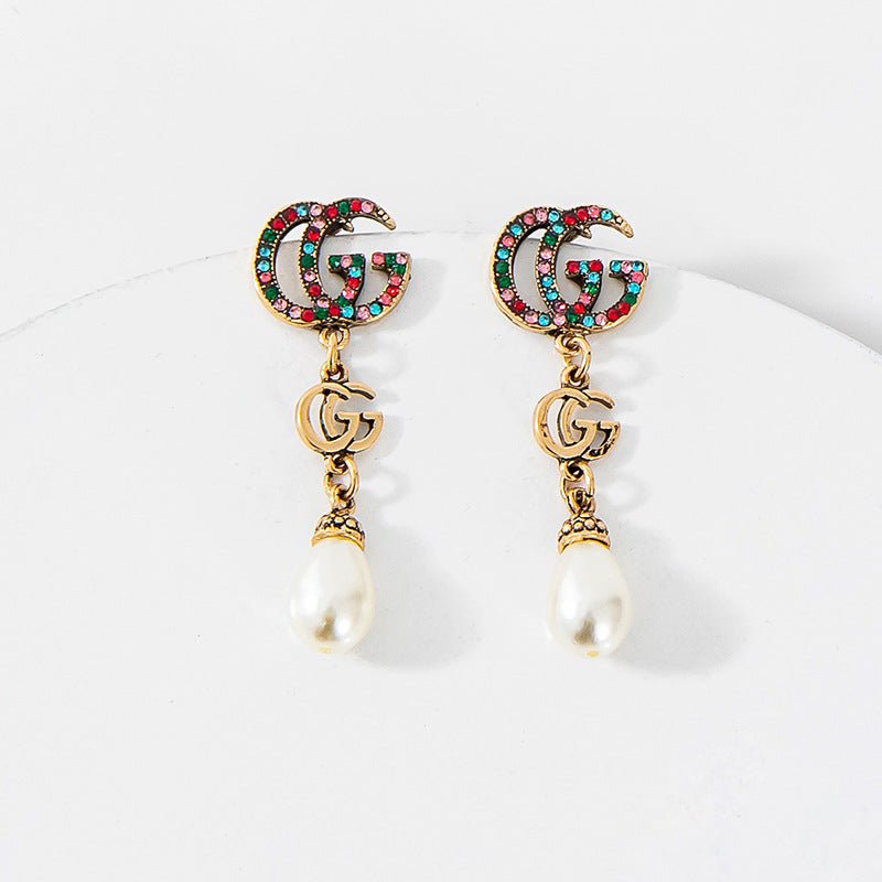 Pearl drop g earrings